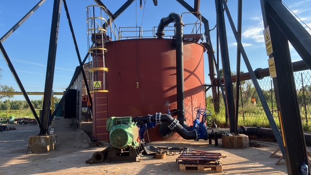 Large industrial storage tank with pump equipment